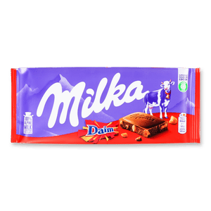 Шоколад молочний Milka зі шматочками карамелі з мигдалем